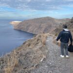 Hikers enjoying the Santorini caldera view while trekking from Fira to Oia