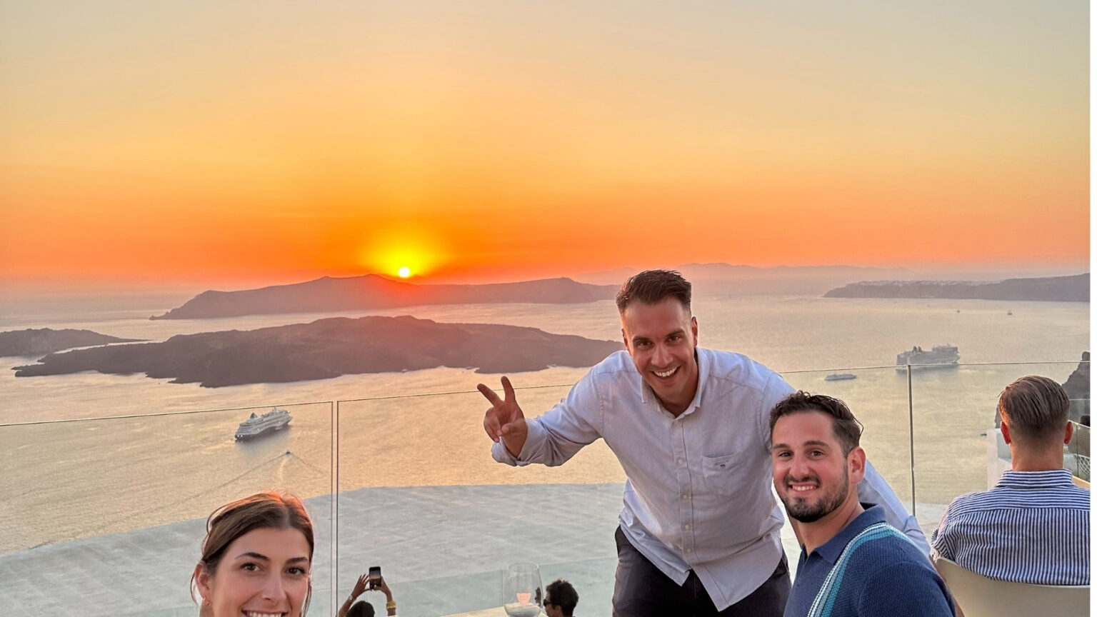 Enjoy your wine while watching the magnificent sunset in Santorini